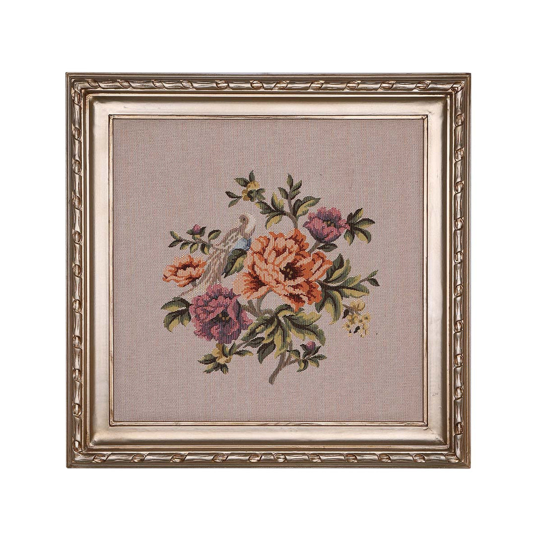 Framed floral tapestry on a beige background