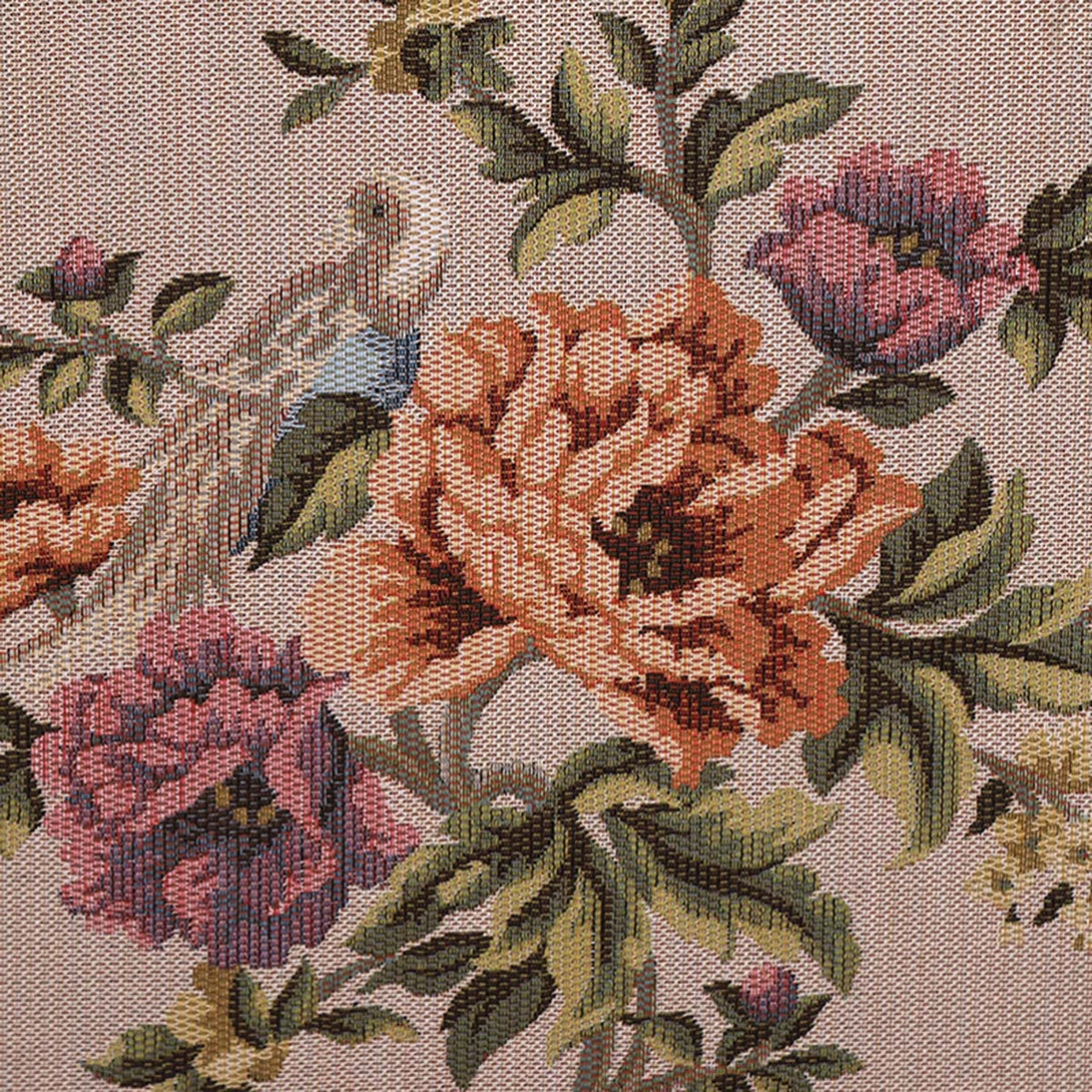 Close-up of floral patterned fabric with pink, orange, and green flowers.